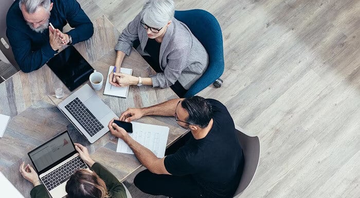 A group of professionals collaborating around a table