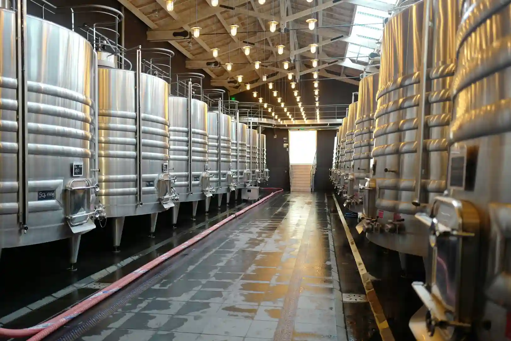 Rows of kegs in large facility room