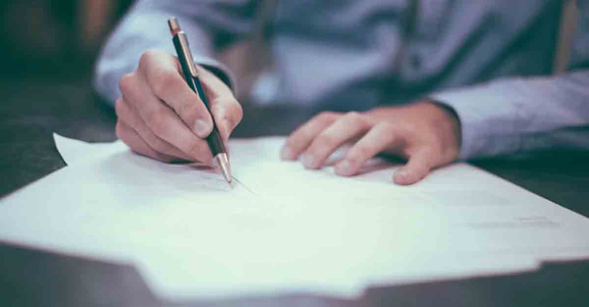 A person signing a lease agreement that complies with new lease accounting standards.