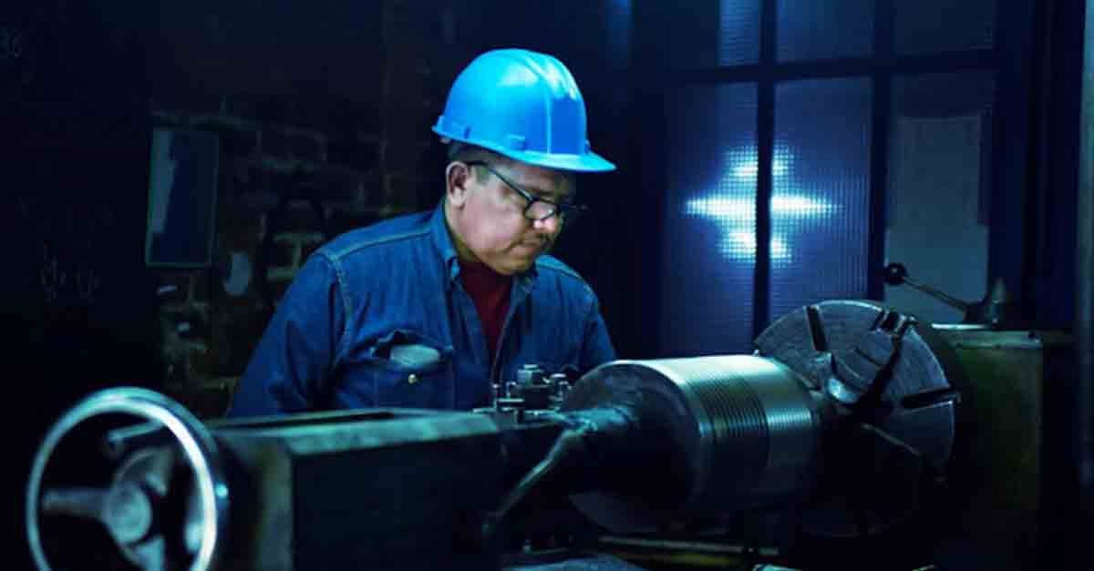 Engineer conducting maintenance check on equipment, ensuring proper functioning and safety.