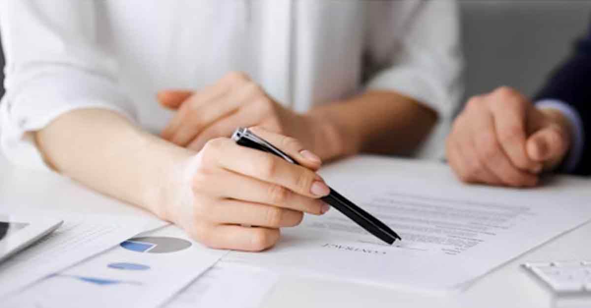 Two people reviewing documents