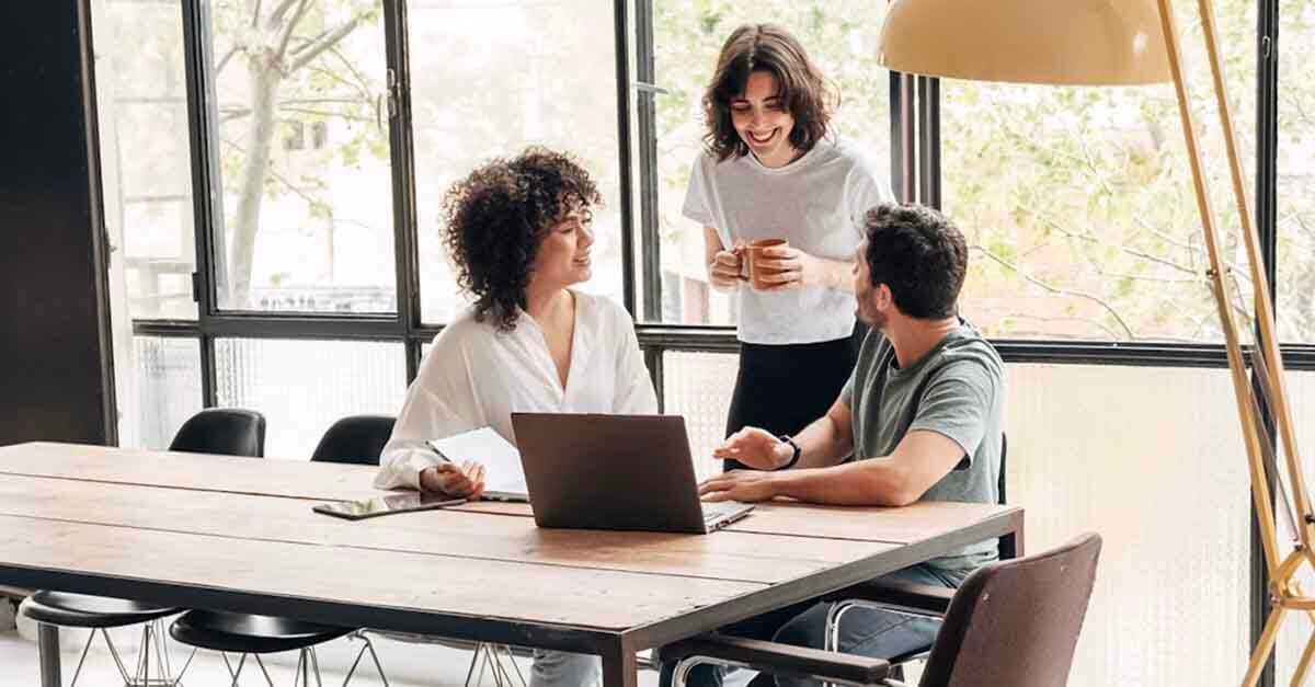 A team is booking meeting room with EMS Flex: One-Click Desk Booking