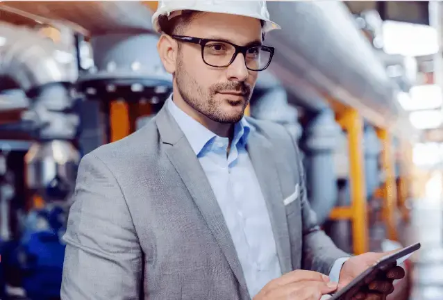 An engineer inspecting energy sustainability in a factory