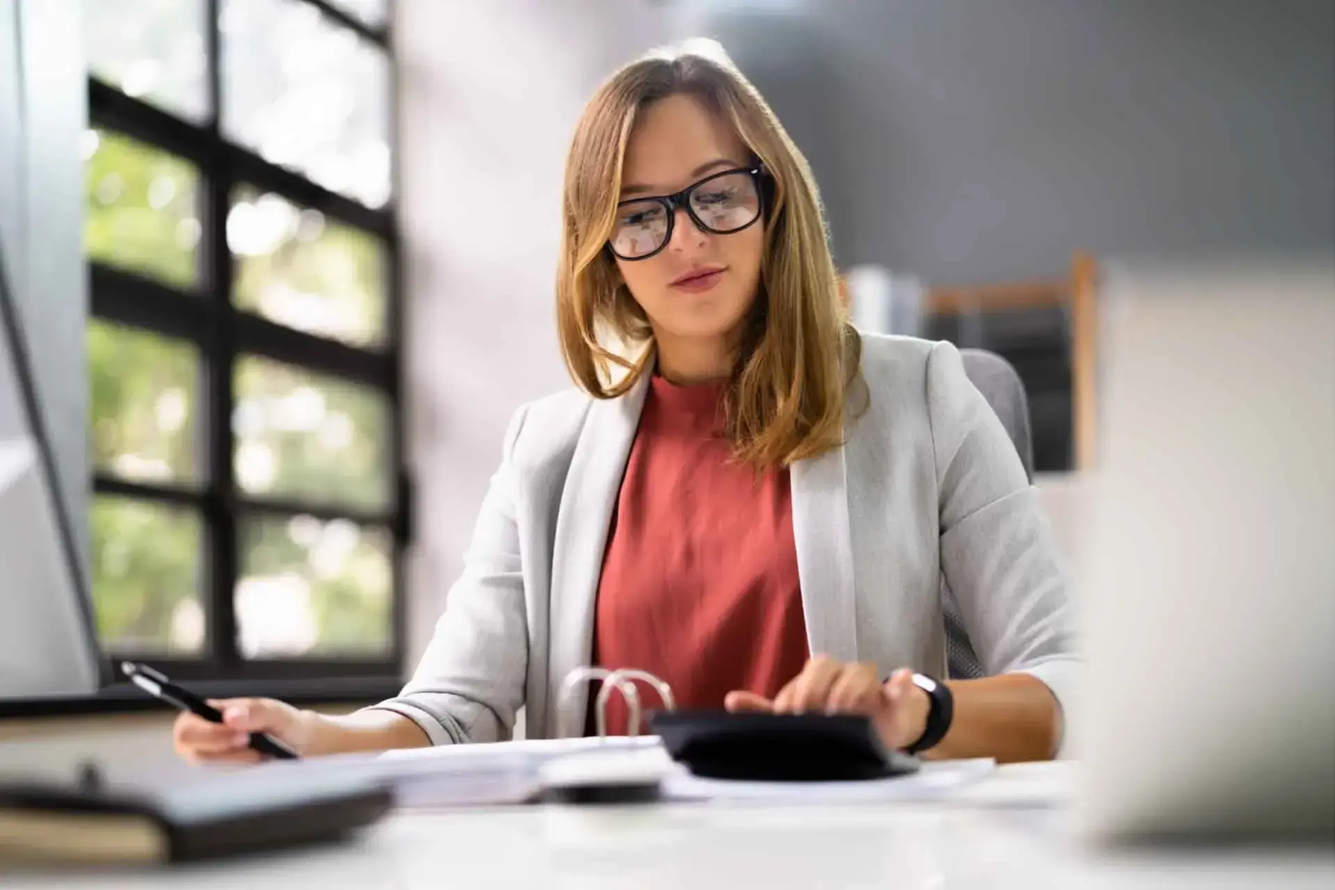 A businesswoman is reviewing business transactions